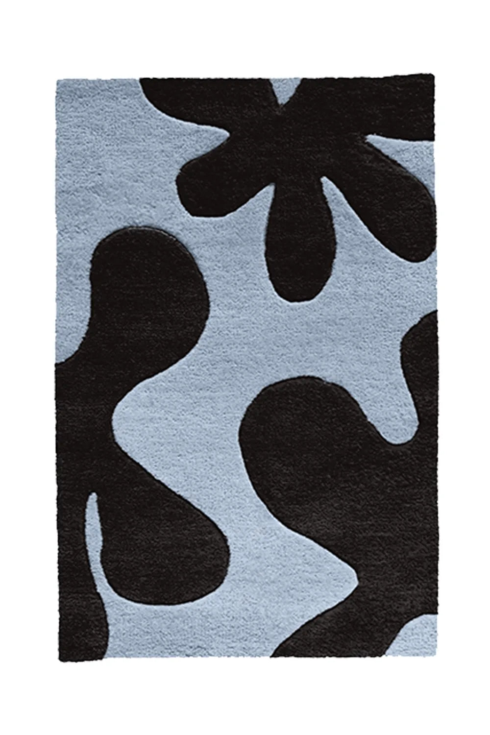 A statement rug featuring deep black abstract shapes against a soft blue background for a striking contrast