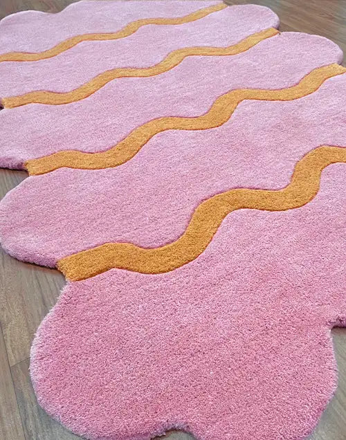 custom sculpted edge wool modern rug in playful pink and orange