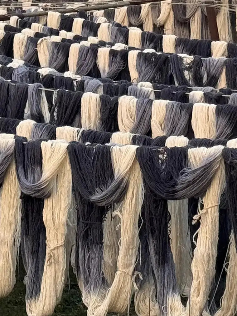 Bundles of hand-dyed New Zealand wool prepared for custom rugs