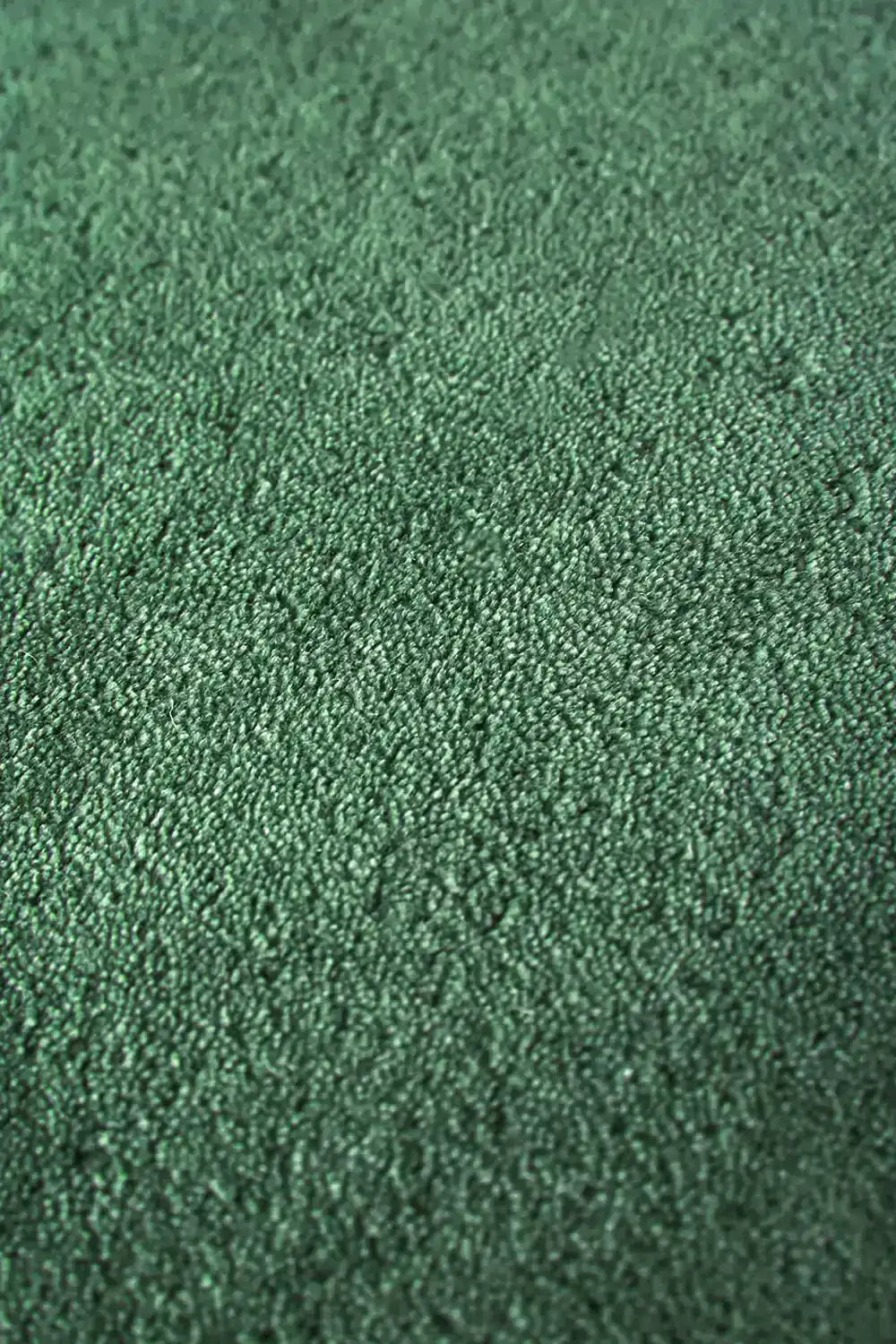 texture detail of emerald green hand tufted wool rug