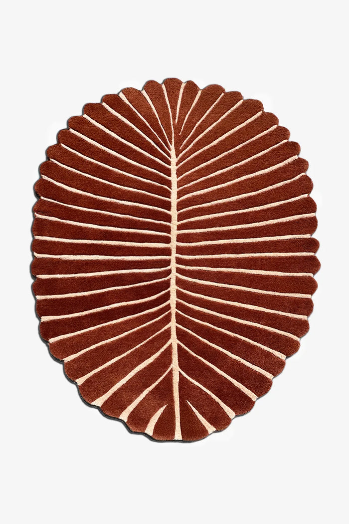 5x8 oval leaf-shaped rug in terracotta and cream with organic scalloped edges for modern boho or coastal interiors