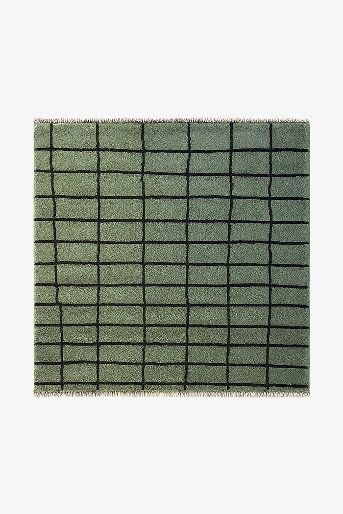 Green square wool rug with organic grid pattern, hand-knotted from wool and perfect for colorful modern interiors