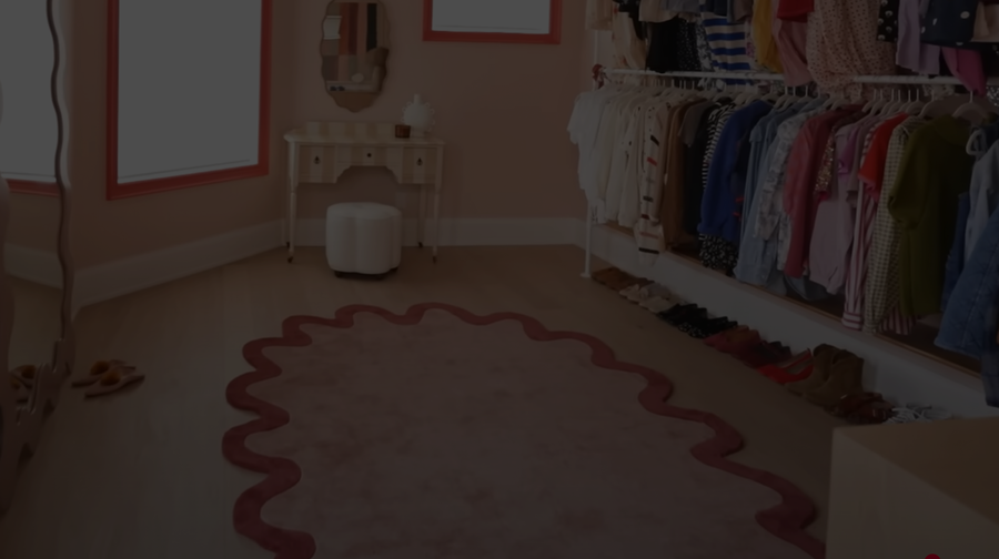 Banner showing the Halo Burst irregular scalloped rug in terracotta tones, styled in a sunlit modern room