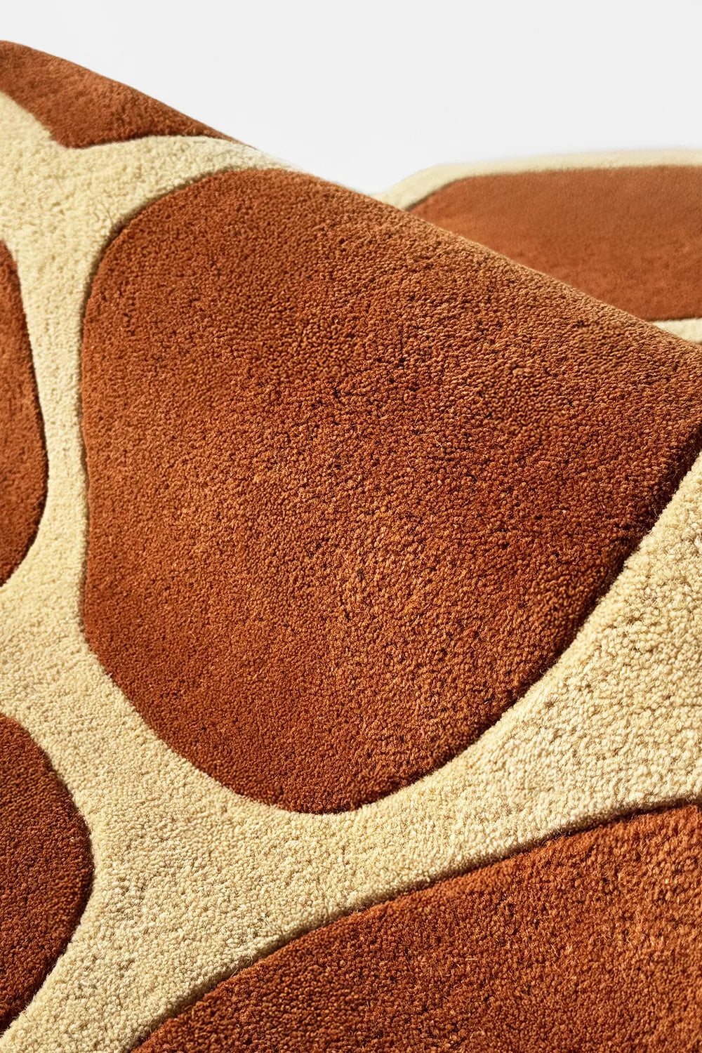 Plush texture of a contemporary earth-toned abstract rug with a geometric pattern, a cool accent rug with fun, wavy silhouette