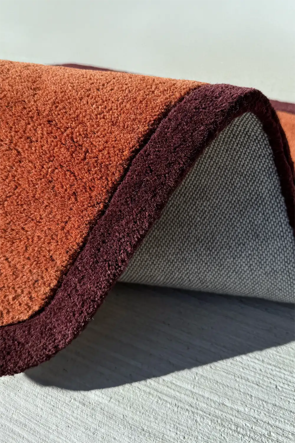 Handmade 3x5 brown wool rug with plush pile and soft curved edges for modern homes