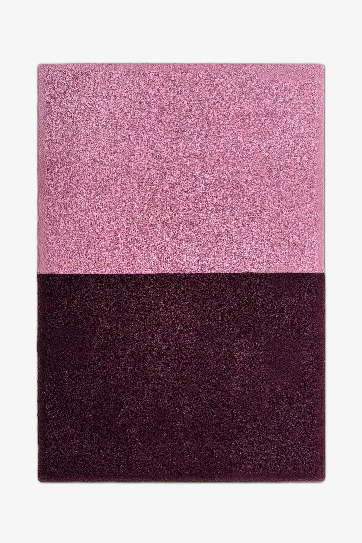 8x10 modern two-tone area rug in muted mauve pink and rich plum purple, perfect for minimalist bedrooms, cozy living rooms, or bold entryways berry