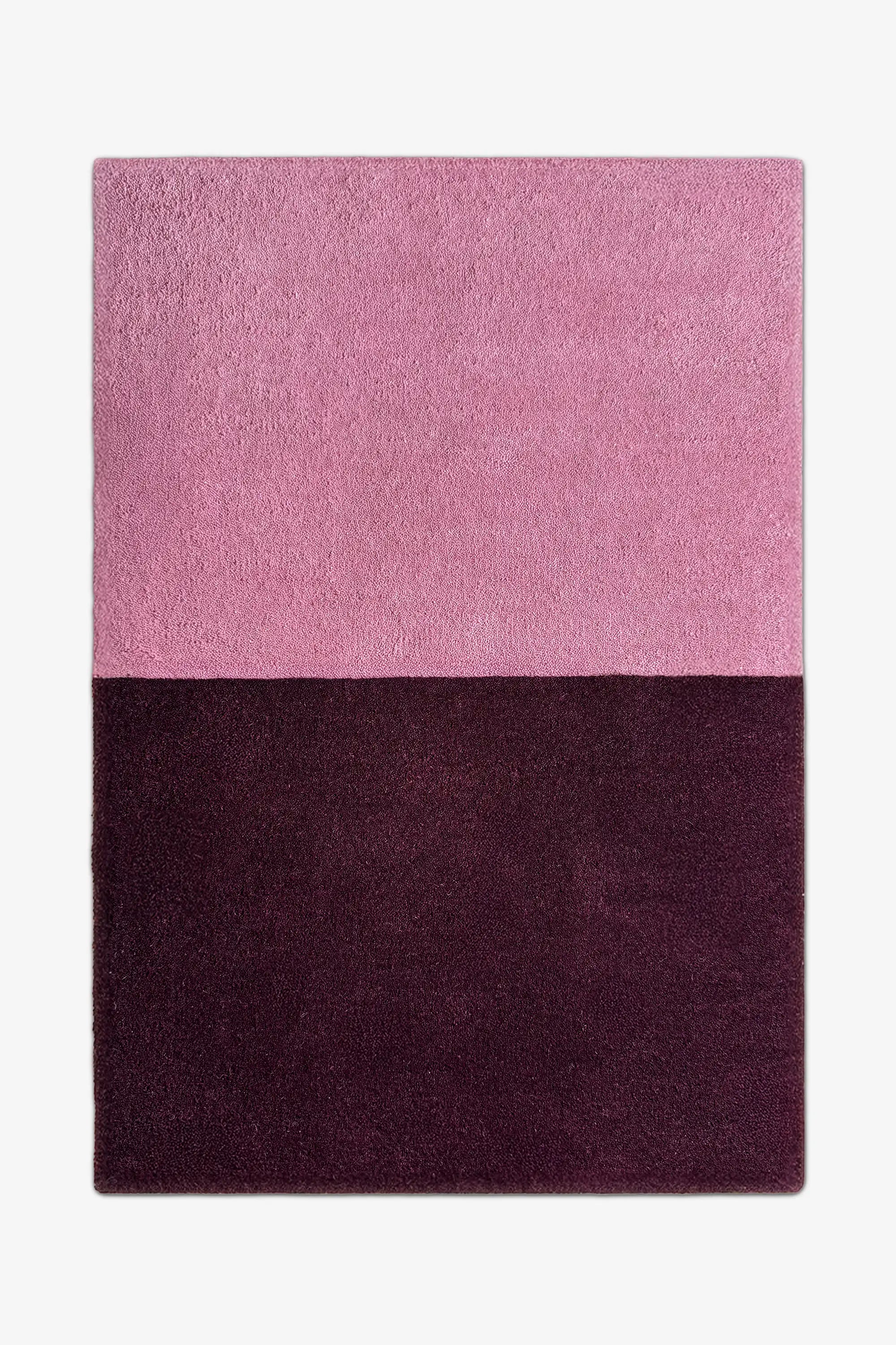 8x10 modern two-tone area rug in muted mauve pink and rich plum purple, perfect for minimalist bedrooms, cozy living rooms, or bold entryways.