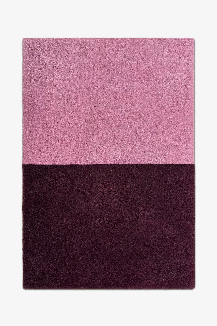 8x10 modern two-tone area rug in muted mauve pink and rich plum purple, perfect for minimalist bedrooms, cozy living rooms, or bold entryways berry