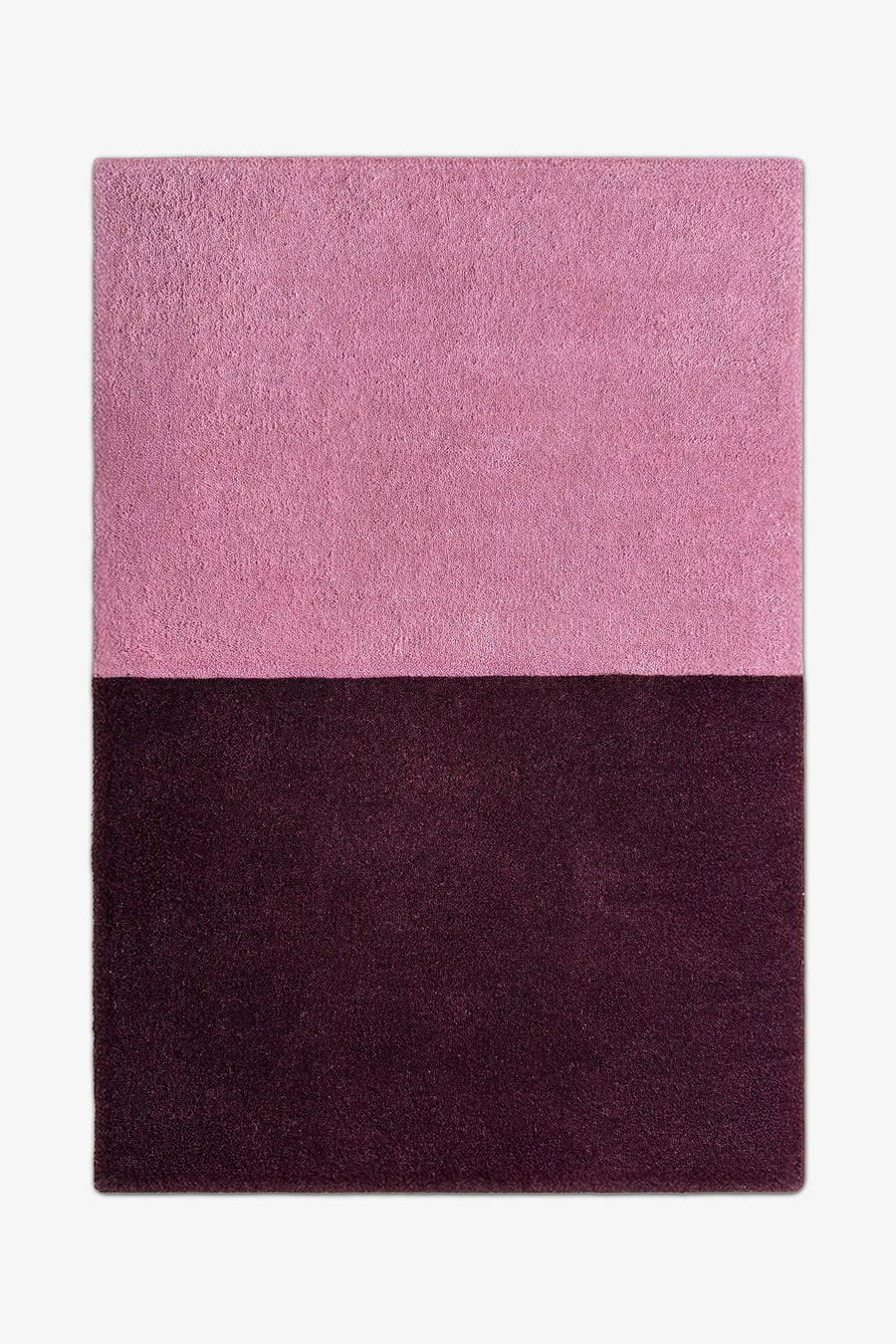 8x10 modern two-tone area rug in muted mauve pink and rich plum purple, perfect for minimalist bedrooms, cozy living rooms, or bold entryways.