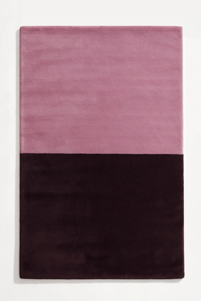 8x10 modern two-tone area rug in muted mauve pink and rich plum purple, perfect for minimalist bedrooms, cozy living rooms, or bold entryways berry