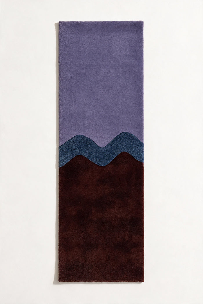 Hand-tufted purple and brown runner rug with sculptural wavy design, available in 2x8 and 2.5x10 runner sizes for modern bedrooms and hallways