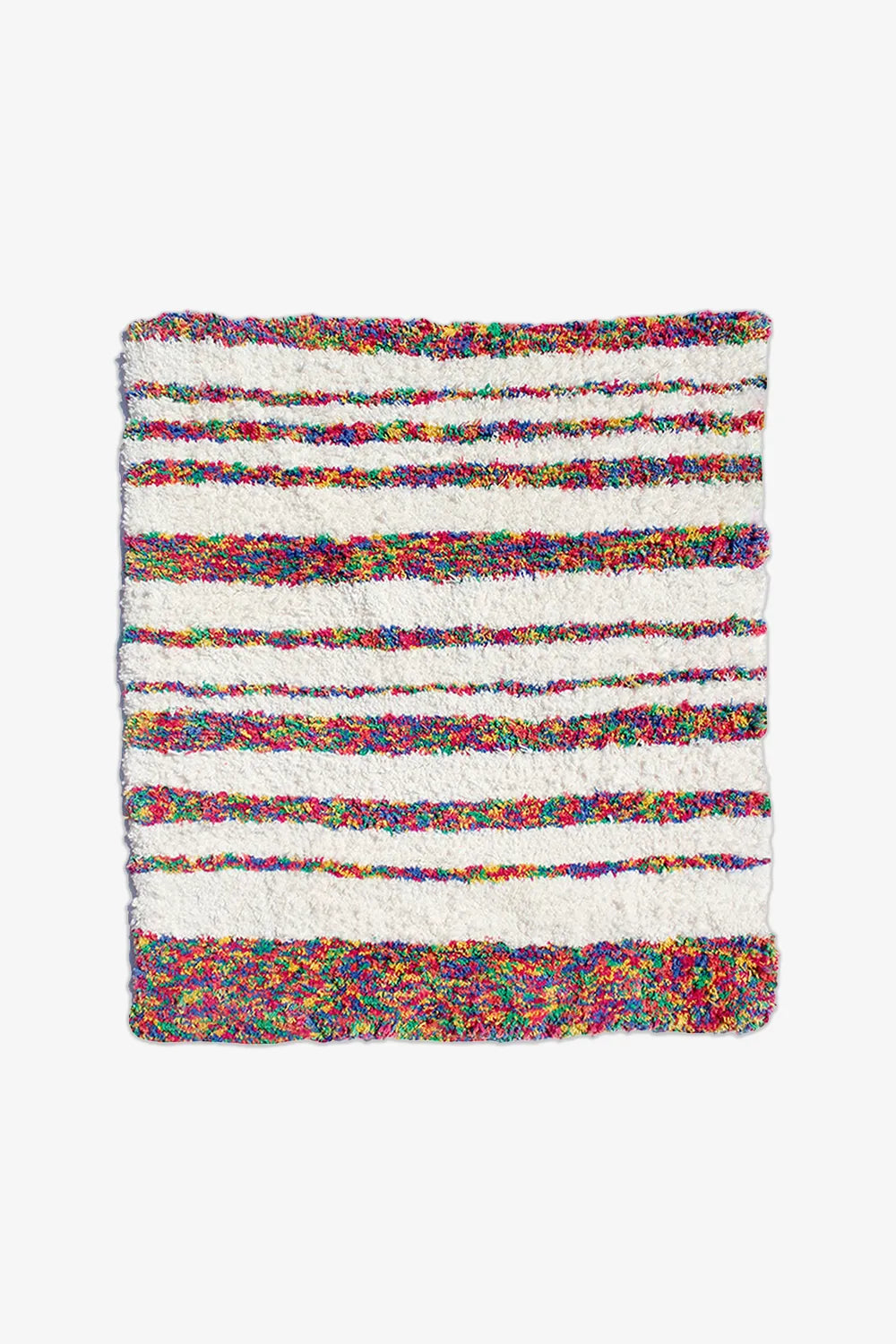 Striped cotton rug in rainbow and cream tones, great as a 4x6 rug, nursery rug, or modern runner rug for hallways or bedrooms