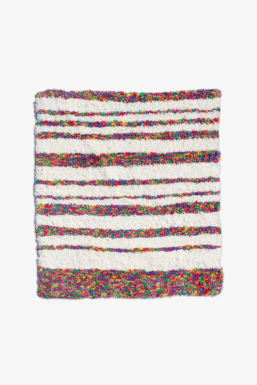 Striped cotton rug in rainbow and cream tones, great as a 4x6 rug, nursery rug, or modern runner rug for hallways or bedrooms