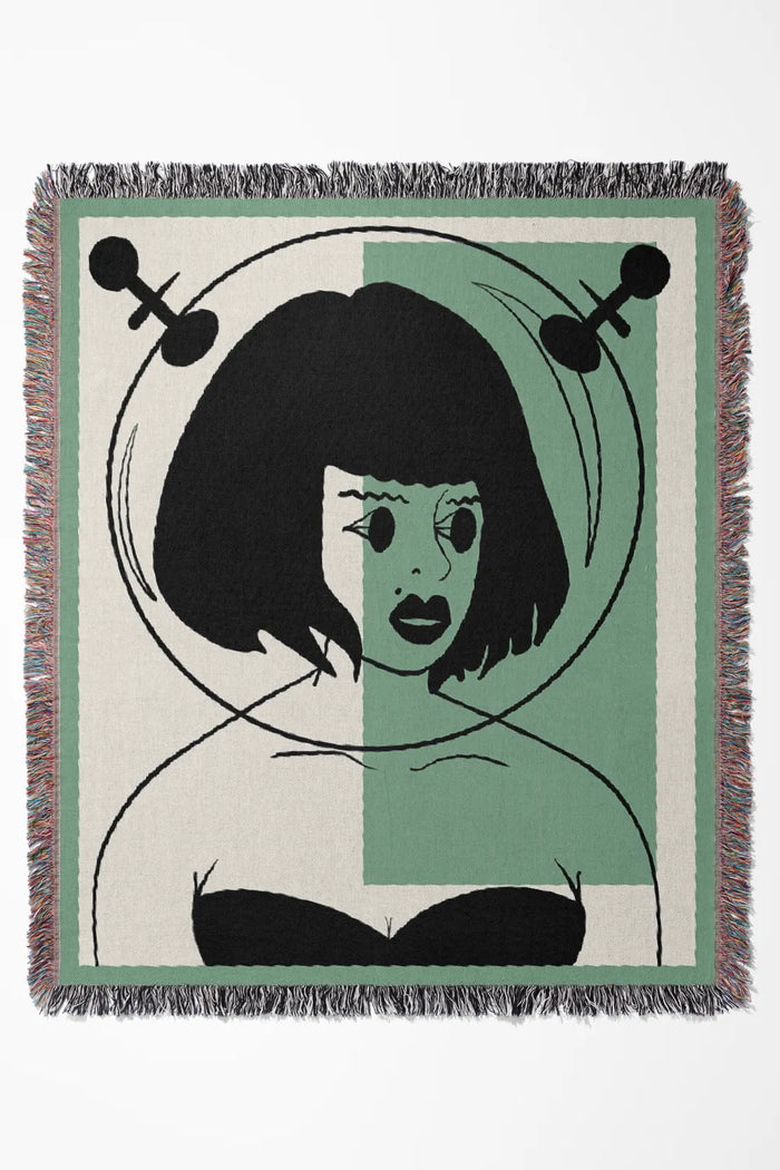 Galactic Muse Alien Cotton Woven Throw Blanket showcasing an alien art design in green, tan, and black.