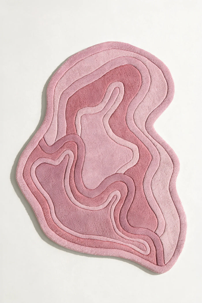 Pink organic shaped rug with sculptural curves, ideal for nursery rugs, funky throw rugs, or custom shaped rugs for bedroom or living room rose