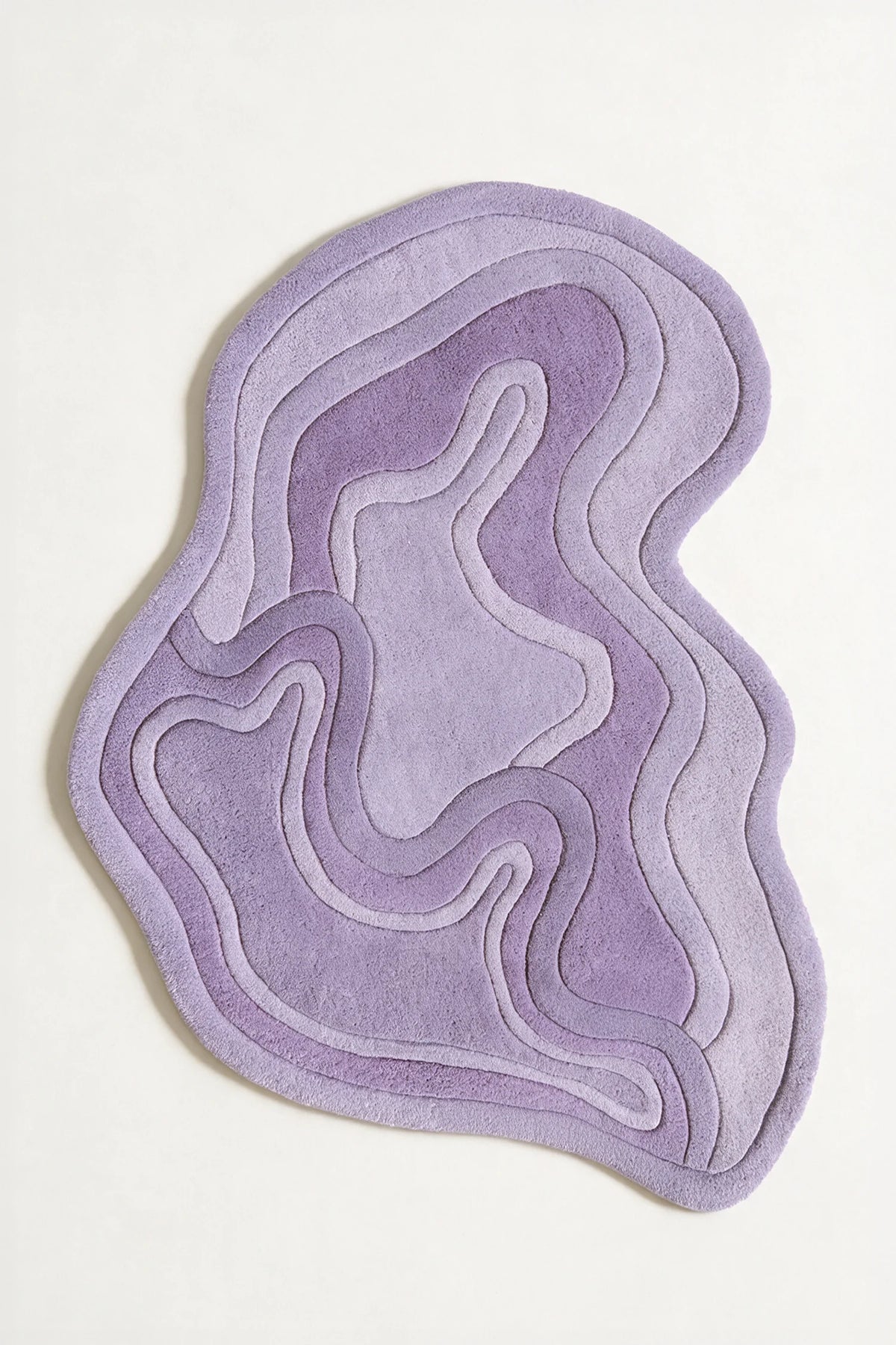 Purple sculptural tufted rug in organic form, great for 4x6 rugs, custom tufted rugs, or colorful wool rugs for modern interiors lavender