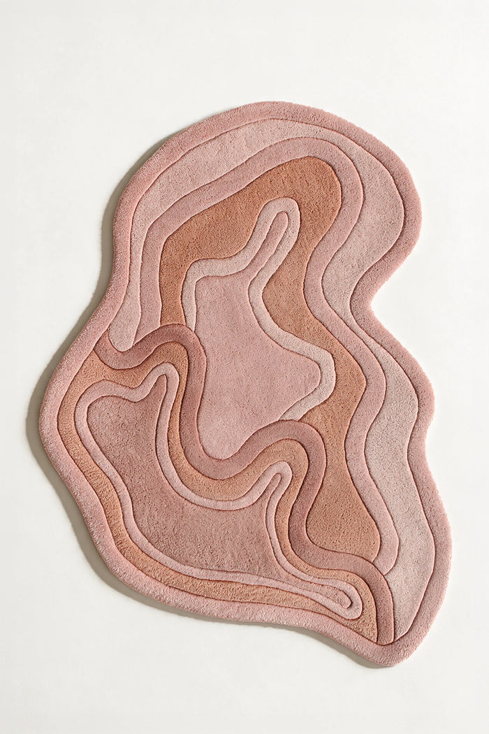 Rust colored abstract shape rug with wavy edge, suited for boho rugs, 5x7 wool area rugs, or custom rugs for bedroom and entryway