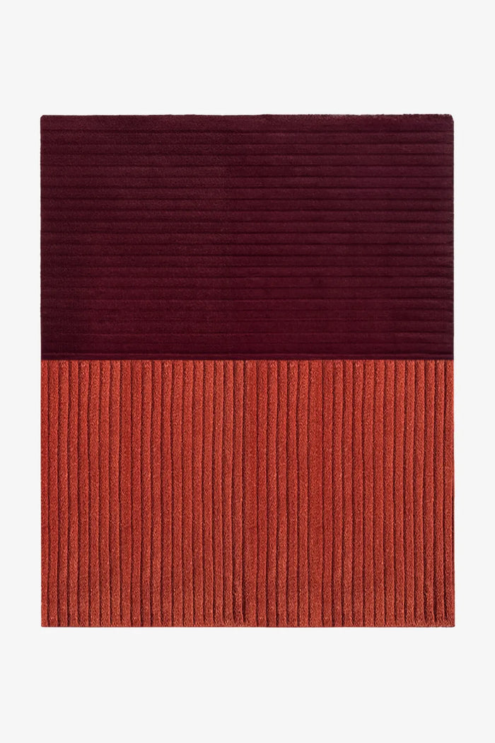 8x10 modern two-tone wool rug with deep burgundy and rust blocks and sculpted linear texture