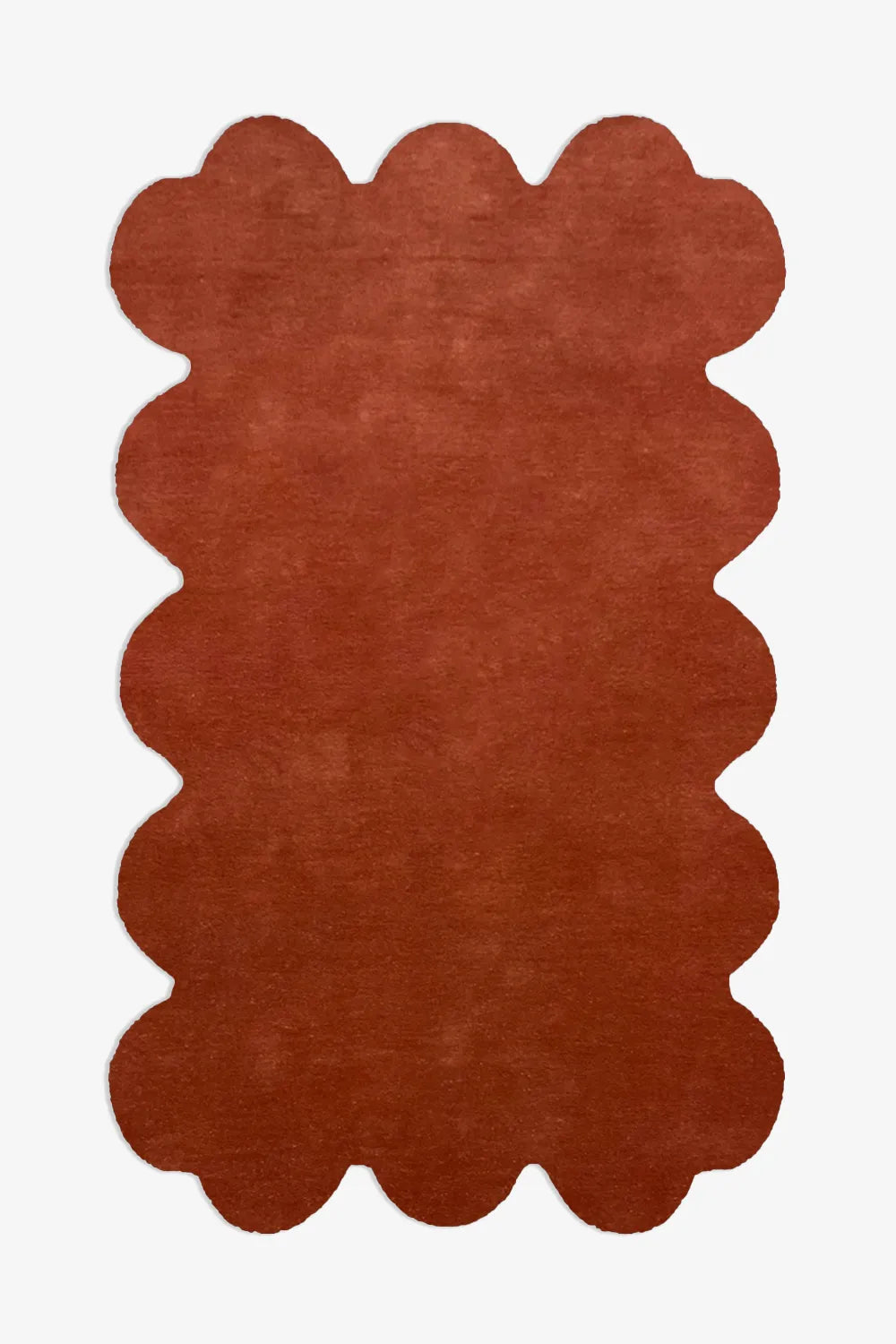 8x10 rust scalloped edge wool rug with sculptural silhouette, perfect for modern boho living rooms