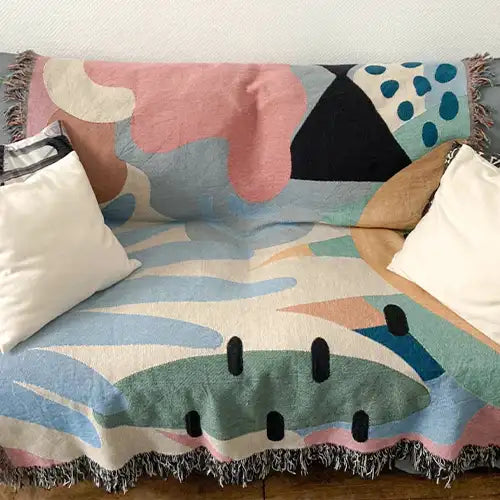 Tropical pastel throw blanket with palm motifs in soft pink, peach, and mint, ideal as a summer cotton throw or decorative accent blanket