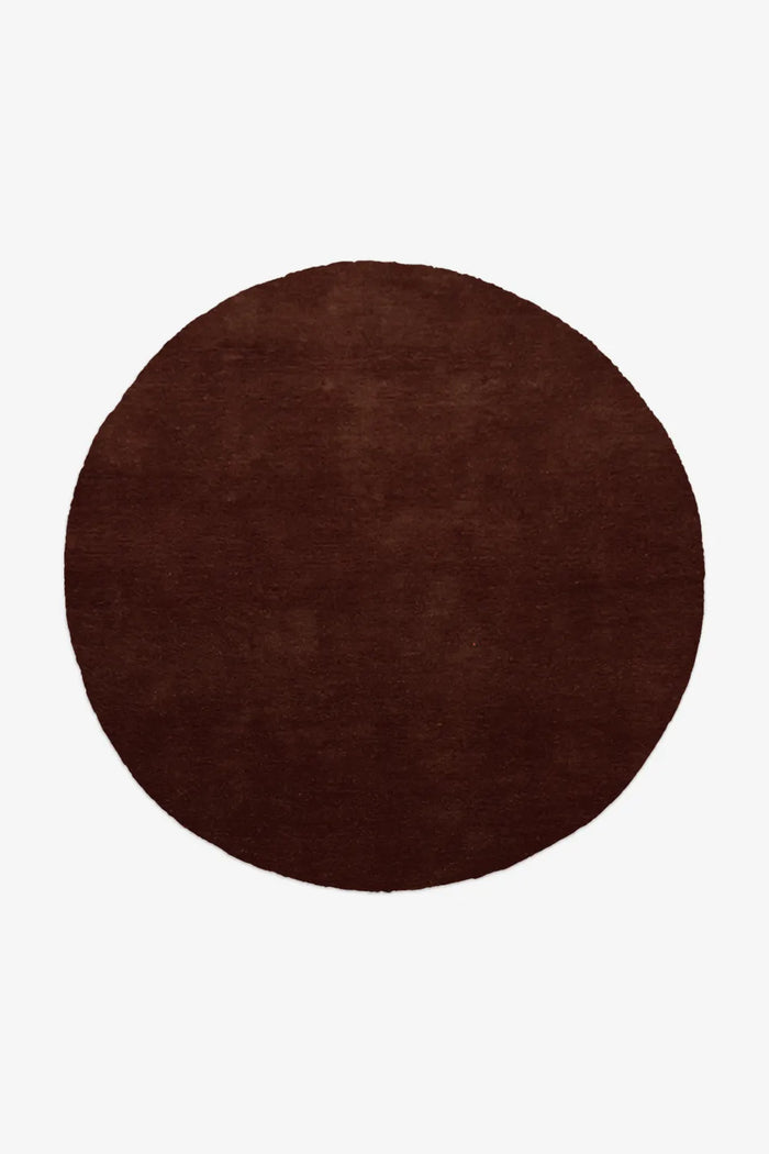 6 ft dark brown round wool rug in solid chocolate, hand-tufted and ideal for modern interiors