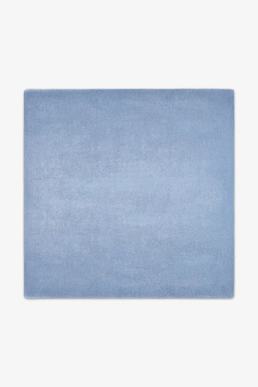 Soft light baby blue wool square rug styled in 9x9 or 11x11 sizes, perfect for creating a calm modern dining space