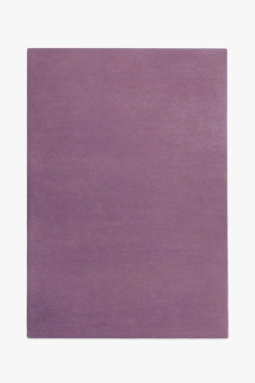 Soft muted lavender wool area rug in 5x8 sizing, perfect for cozy bedrooms, modern colorful nurseries, or boho rugs