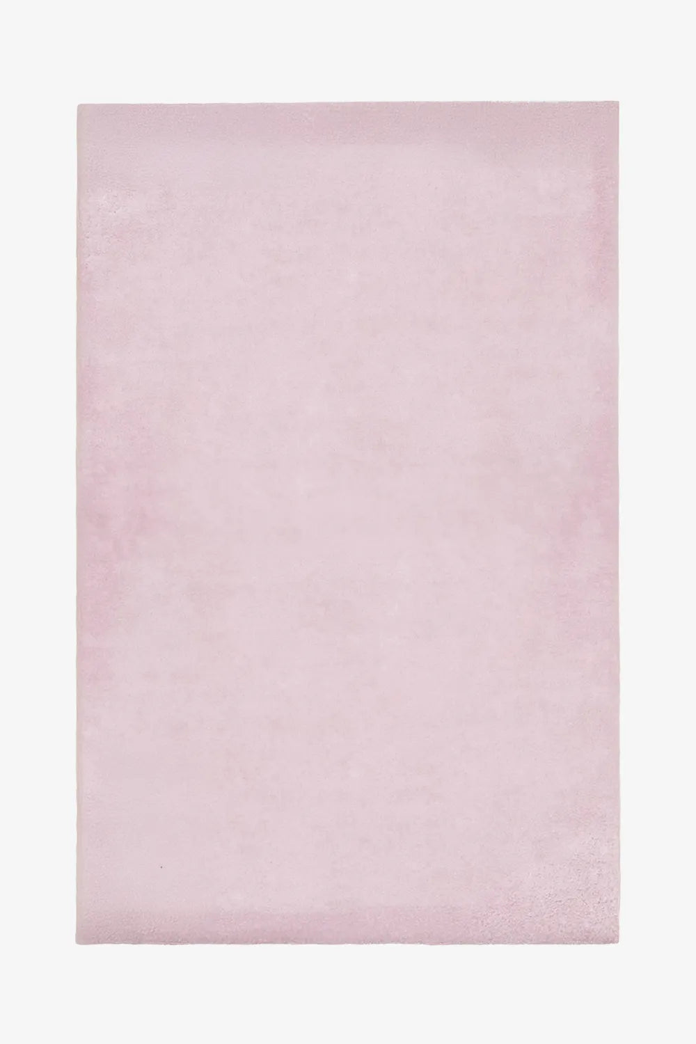 Blush pink wool rug in 6x9 or 5x7 size, perfect for nursery rugs, bedroom rugs, or soft pastel modern interiors