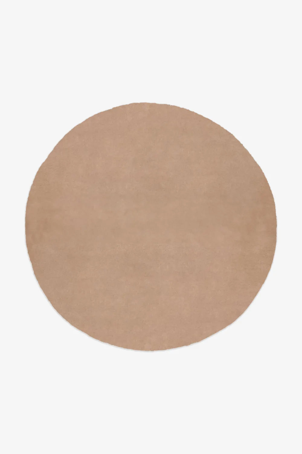 Warm camel beige large round rug for neutral modern interiors