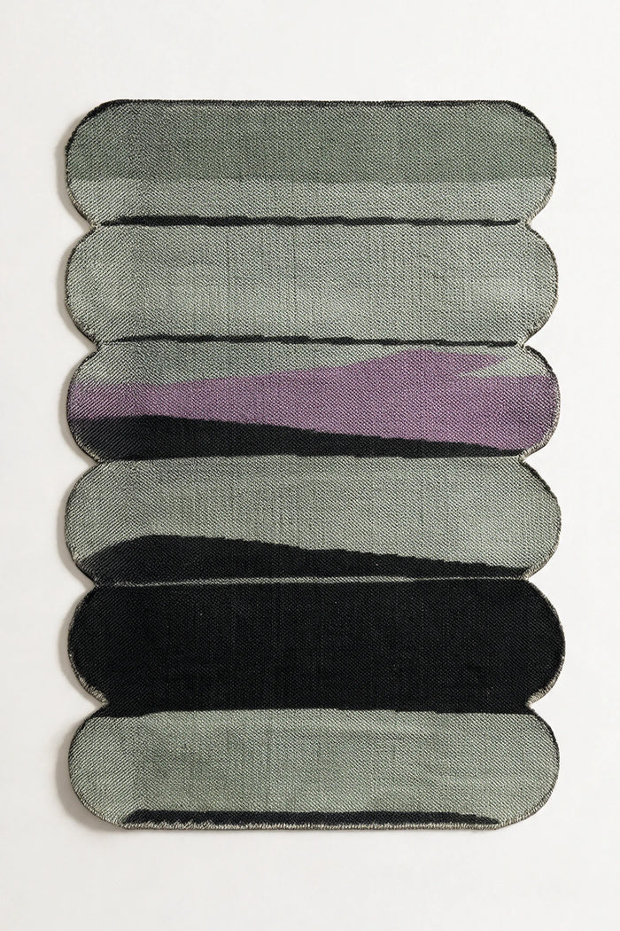 5x8 green and purple flatwoven rug with sculpted rounded edges and abstract curved stripe pattern