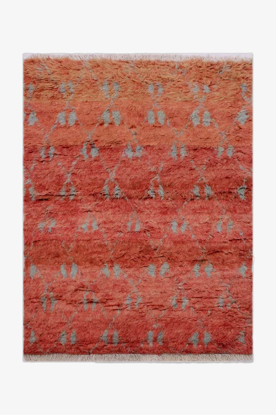 Hand-knotted terracotta shag rug with light gray accents, shown in 8x10 sizing, perfect for modern living rooms, boho interiors, and cozy bedrooms