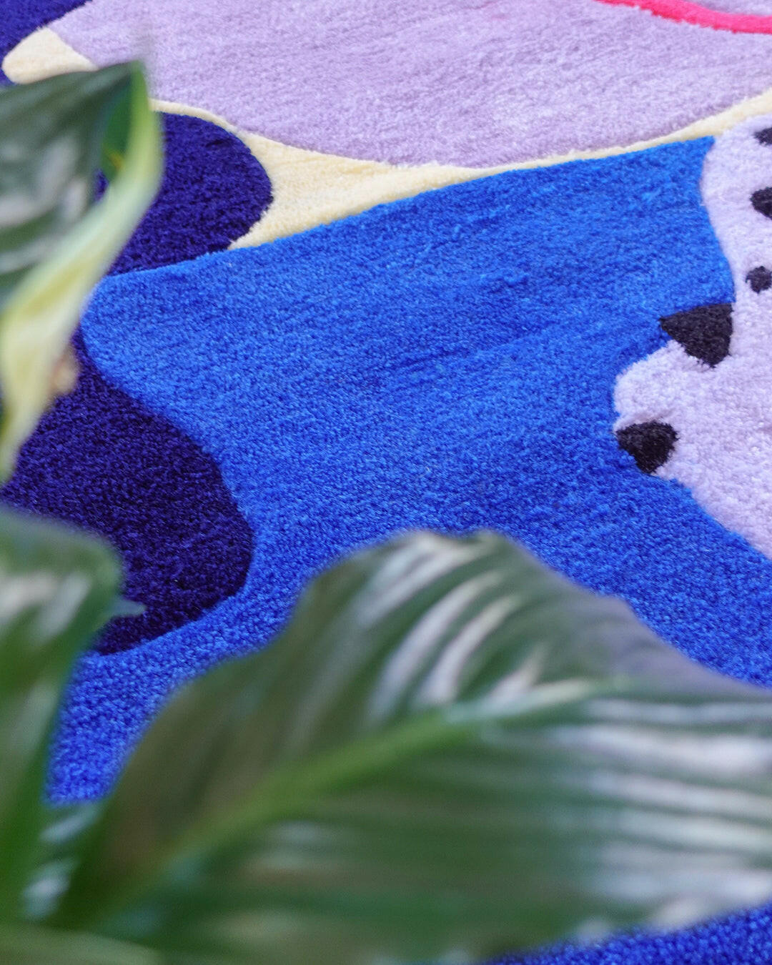 Funky wool rug with organic color blocking in blue, lavender, yellow, and red