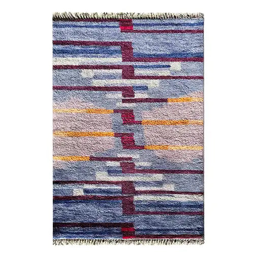 multicolor modern wool area rug in geometric blue, purple and orange graphic pattern