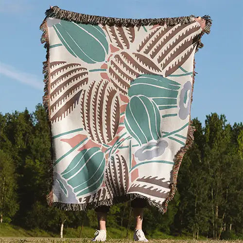 brown cream and teal southwestern inspired cotton woven throw blanket with cactus flower pattern