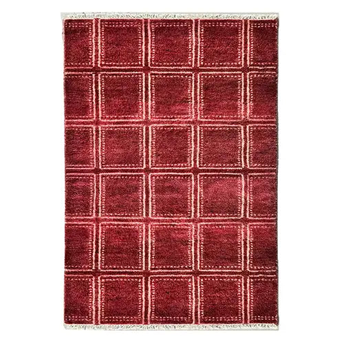 modern geometric dining room rug made from hand knotted wool in brick red