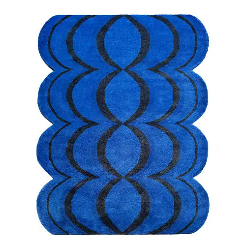 wavy blue area rug with black ripple pattern and scalloped edges for bold modern interiors