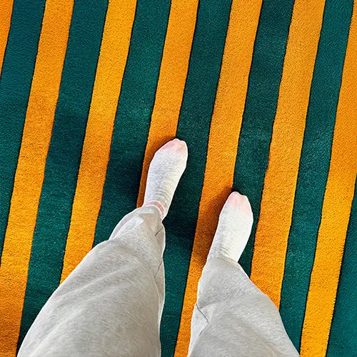green and gold striped hand tufted wool area rug