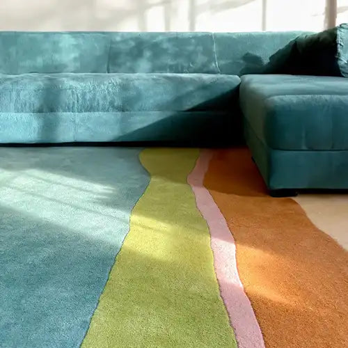 teal living room rug with modern striped pattern in a contemporary coastal room