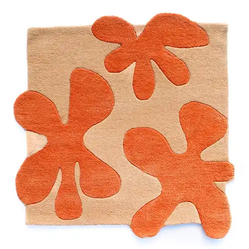 modern abstract floral wool area rug in orange and tan with unique funky 3d effect