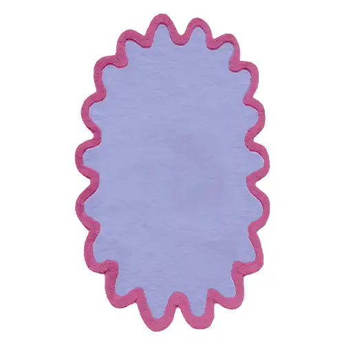 Large pink, purple, and blue oval wool rug with scalloped edges perfect for a modern living room.