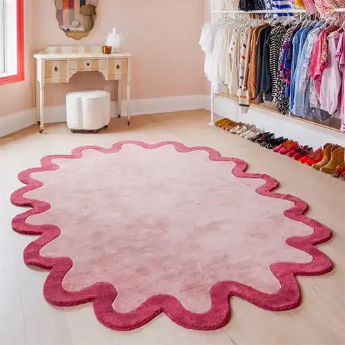 pink scalloped oval wool rug with funky eclectic design