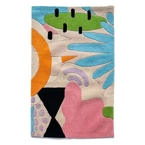 modern tropical wool rug with a funky eclectic pattern in blue pink green orange tan purple and black