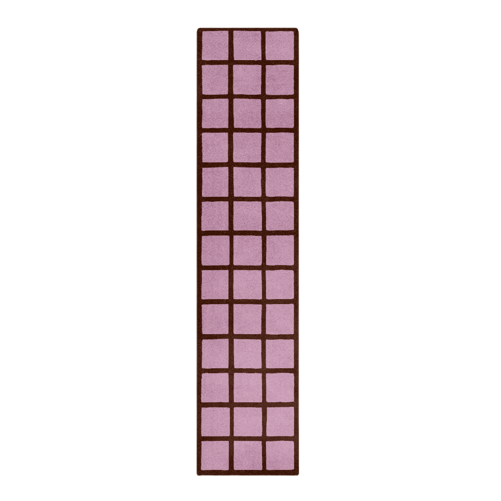 Rectangular pink rug with a grid pattern on a white background