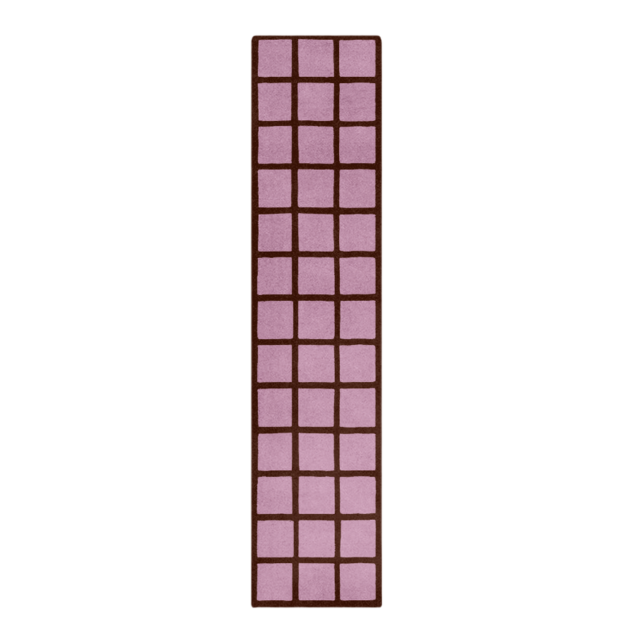 Rectangular pink rug with a grid pattern on a white background