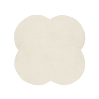 Beige four-leaf clover-shaped rug on a white background