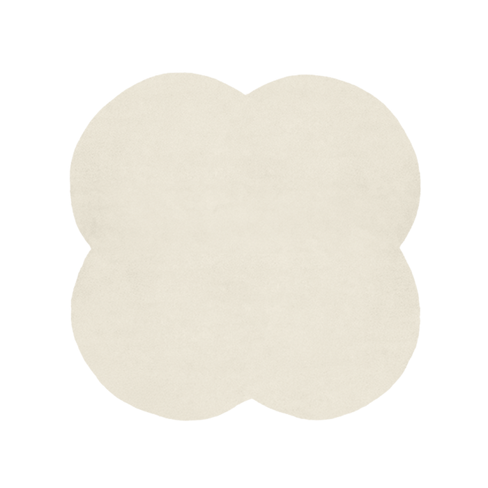 Beige four-leaf clover-shaped rug on a white background