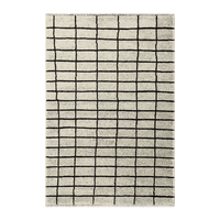 Rug with black grid pattern on a white background