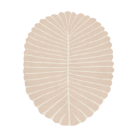 Beige leaf-shaped rug on a white background