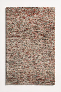 a canyon hand-tufted wool rug with heathered rust, grey and cream flecks shown from above