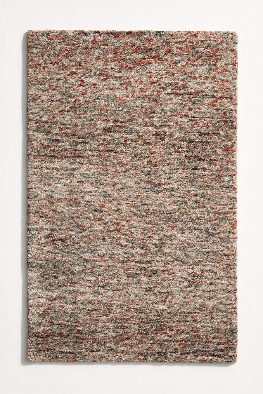 a canyon hand-tufted wool rug with heathered rust, grey and cream flecks shown from above